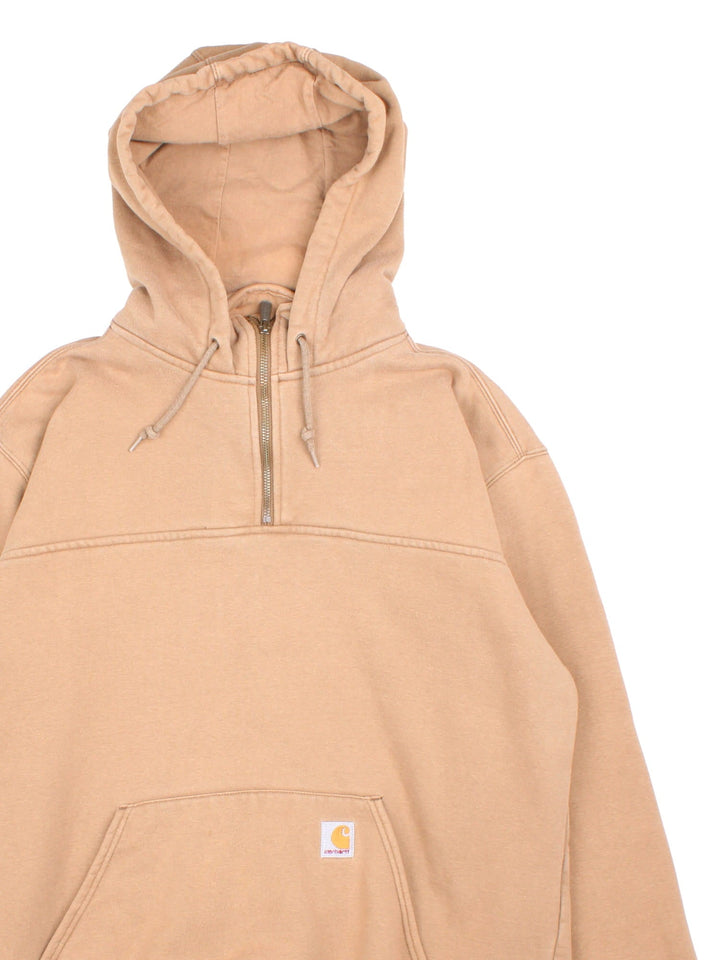 Carhartt 1/4 Zip Hoodie in a tan colourway, features 1/4 zip and large pocket on the front with small classic logo.