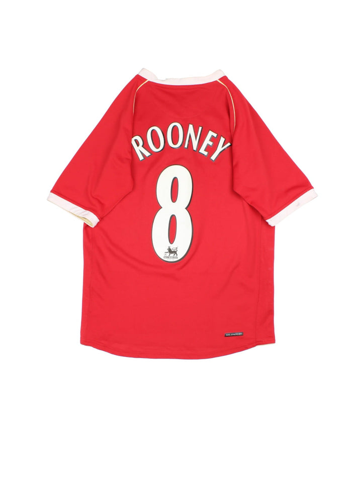 Manchester United 2006-07 Nike Football Shirt in the red home kit colourway, features embroidered badge on the front and player name ROONEY and number #8 on the back.