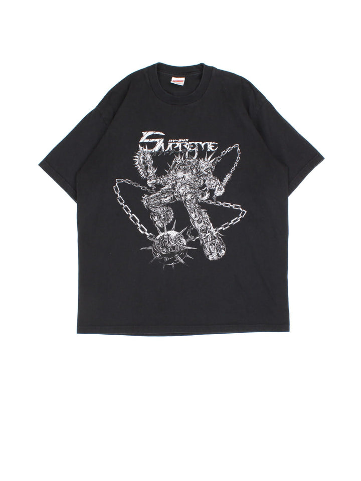 Supreme Spikes T-Shirt in a black colourway, features large spike graphic and logo on the front.