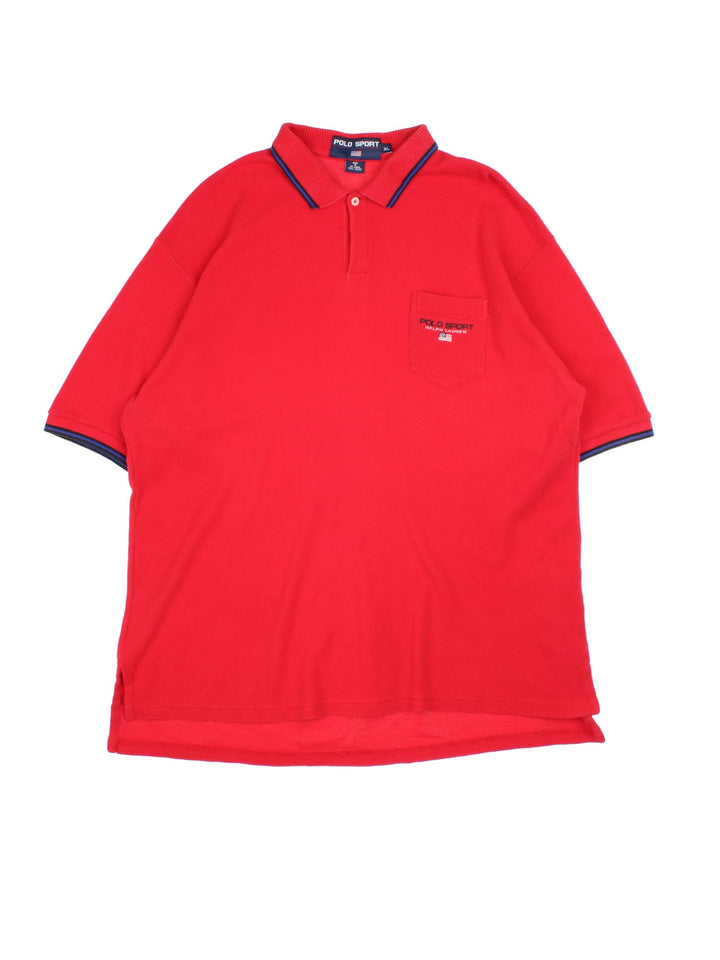 Ralph Lauren Polo Shirt in a red colourway, features pocket on the front with small logo and blue trim arounf the collar and sleeves.