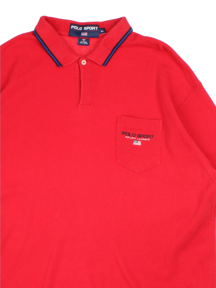 Ralph Lauren Polo Shirt in a red colourway, features pocket on the front with small logo and blue trim arounf the collar and sleeves.