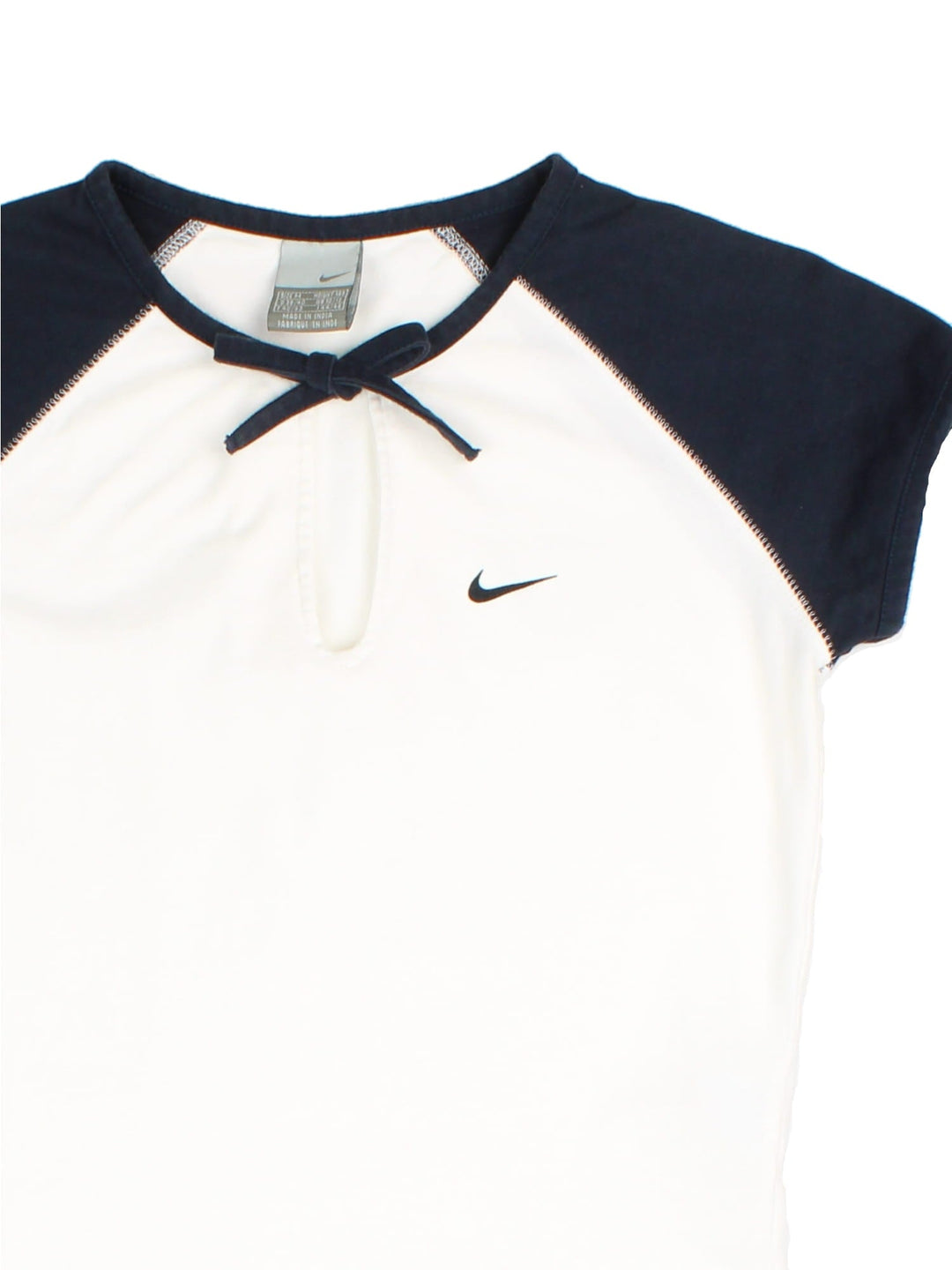 Nike Baby Tee in a white colourway with contrast navy sleves and tie detail. Swoosh branding embroidered on front.