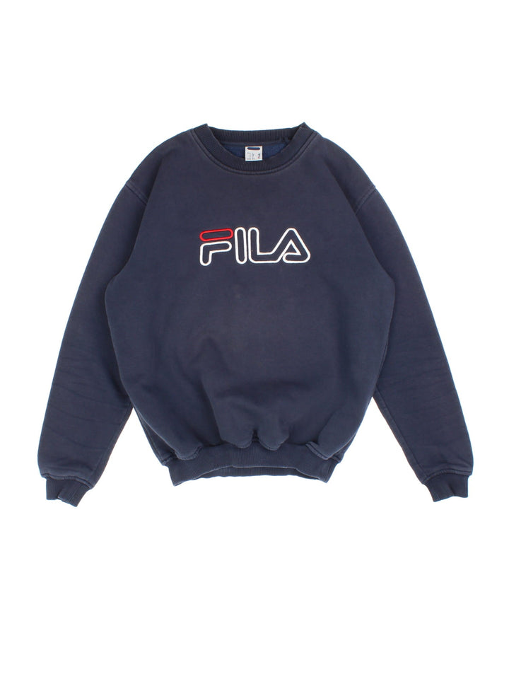 Vintage Fila Shirt in a blue colourway with branding embroidered on front.