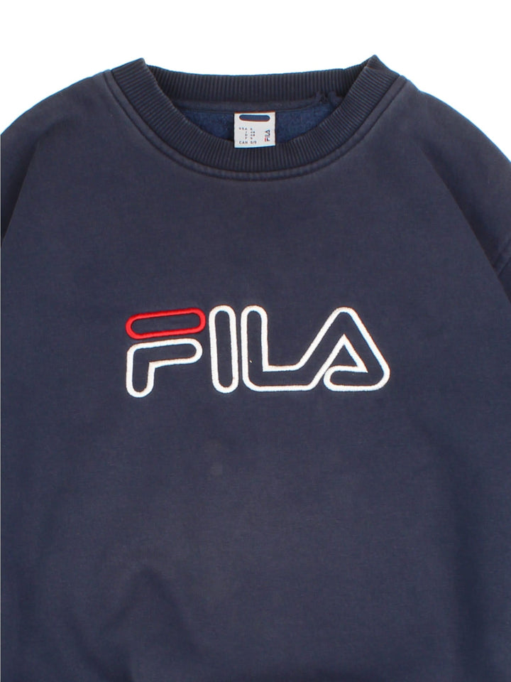 Vintage Fila Shirt in a blue colourway with branding embroidered on front.