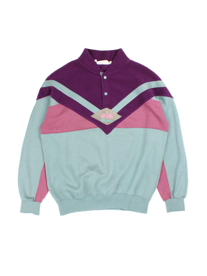 Vintage Lotto Outdoor Sweatshirt popper fastening in purple/pink/green colourway, with fleece panelling and branding embroidered on front.