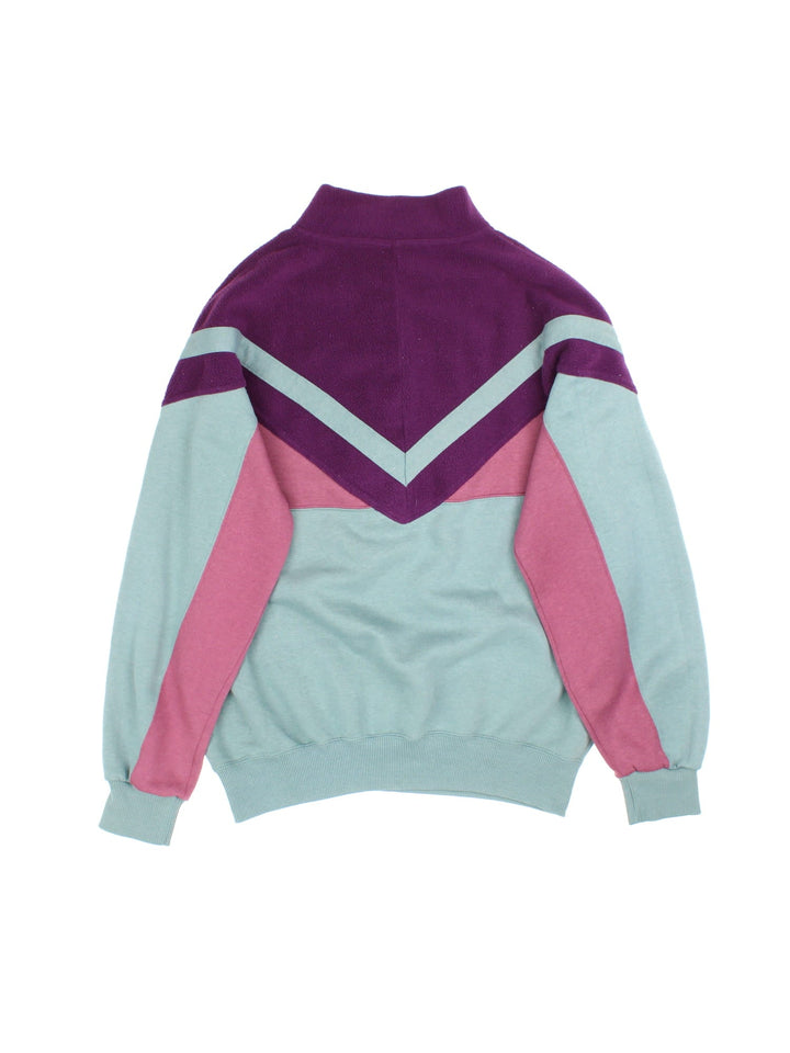 Vintage Lotto Outdoor Sweatshirt popper fastening in purple/pink/green colourway, with fleece panelling and branding embroidered on front.