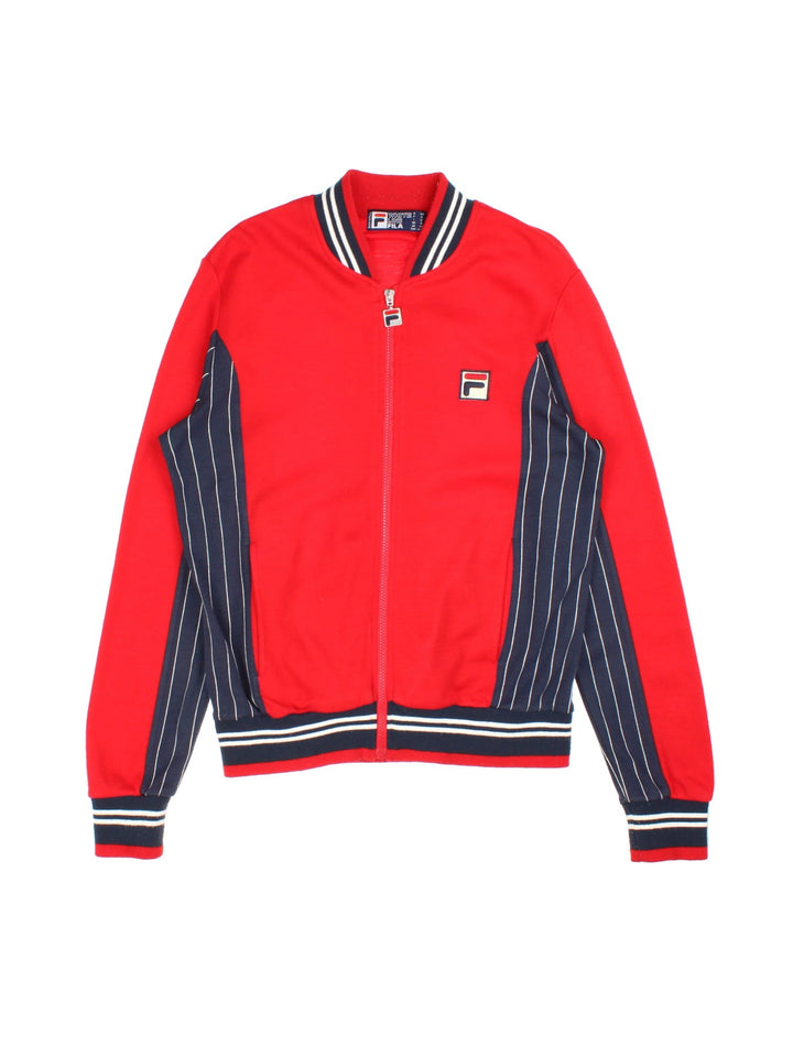 Fila Settanta Jacket in red/blue colourway,zip up fastening, contrast stripe detailing and embroided branded patch.