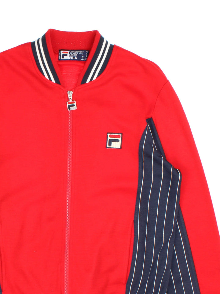 Fila Settanta Jacket in red/blue colourway,zip up fastening, contrast stripe detailing and embroided branded patch.