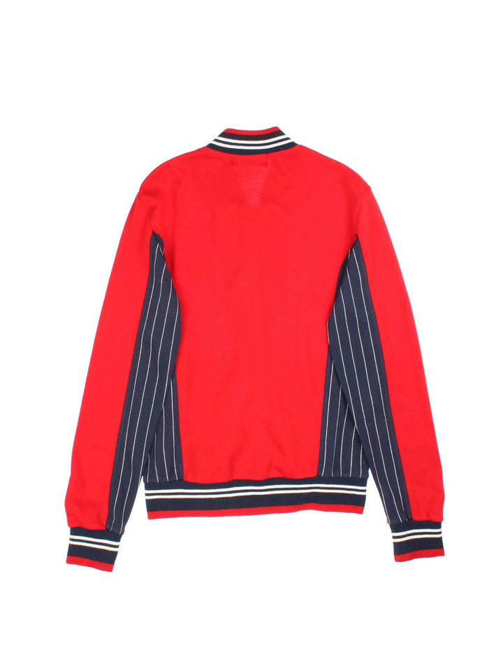 Fila Settanta Jacket in red/blue colourway,zip up fastening, contrast stripe detailing and embroided branded patch.