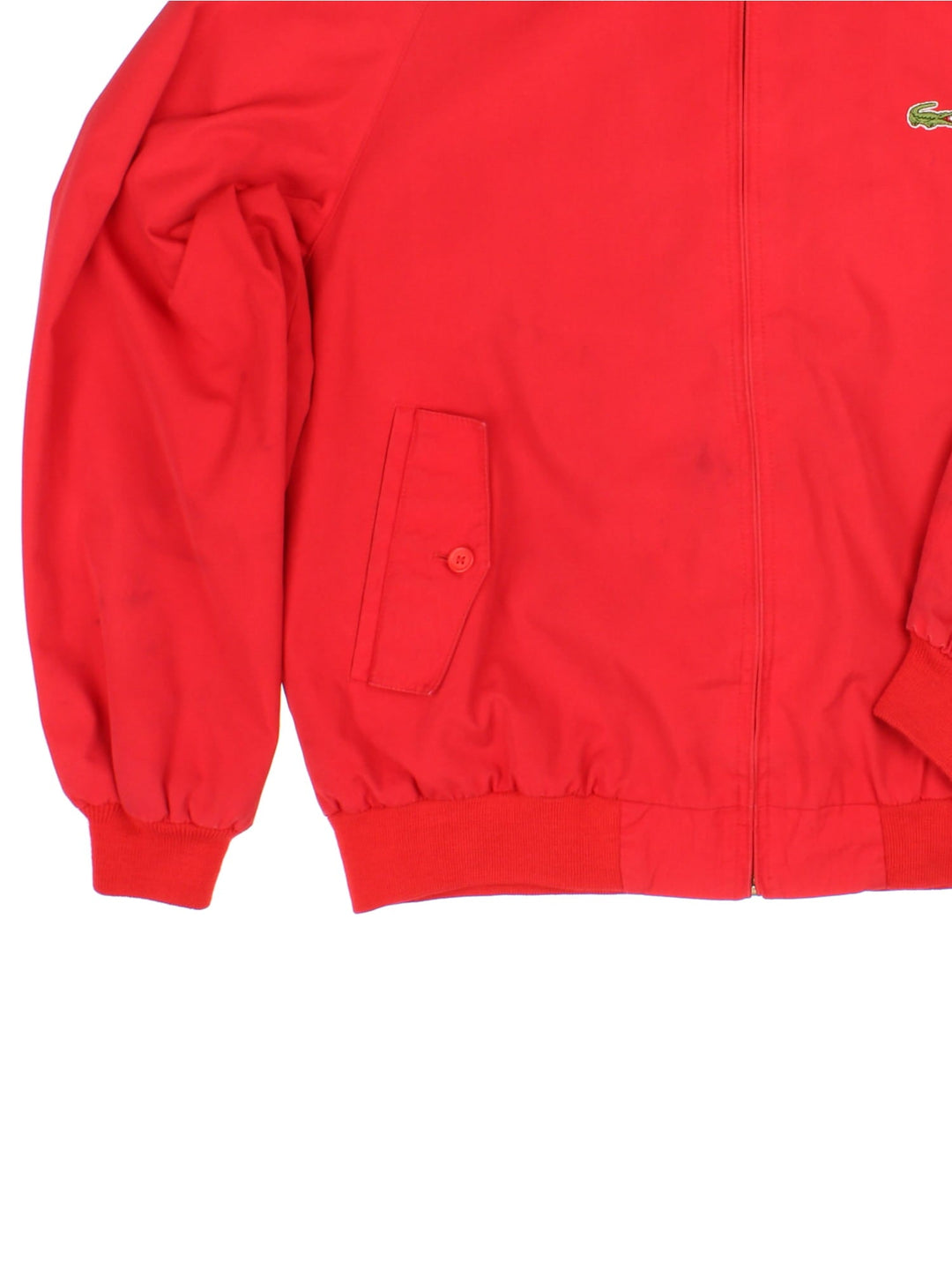 Lacoste Harrington Jacket in red colourway, zip up fastening, contrast checked lining and embroided logo on front.