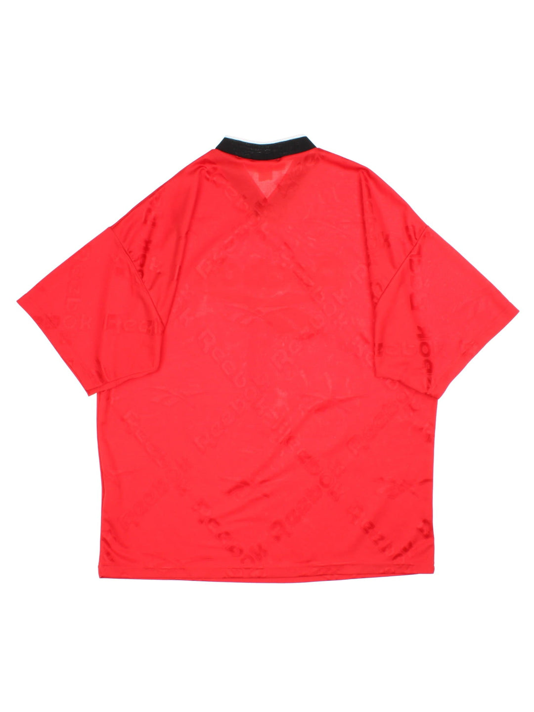 Vintage Reebok Training Top in a red colourway with printed logo fabric and spellout logo on the front.