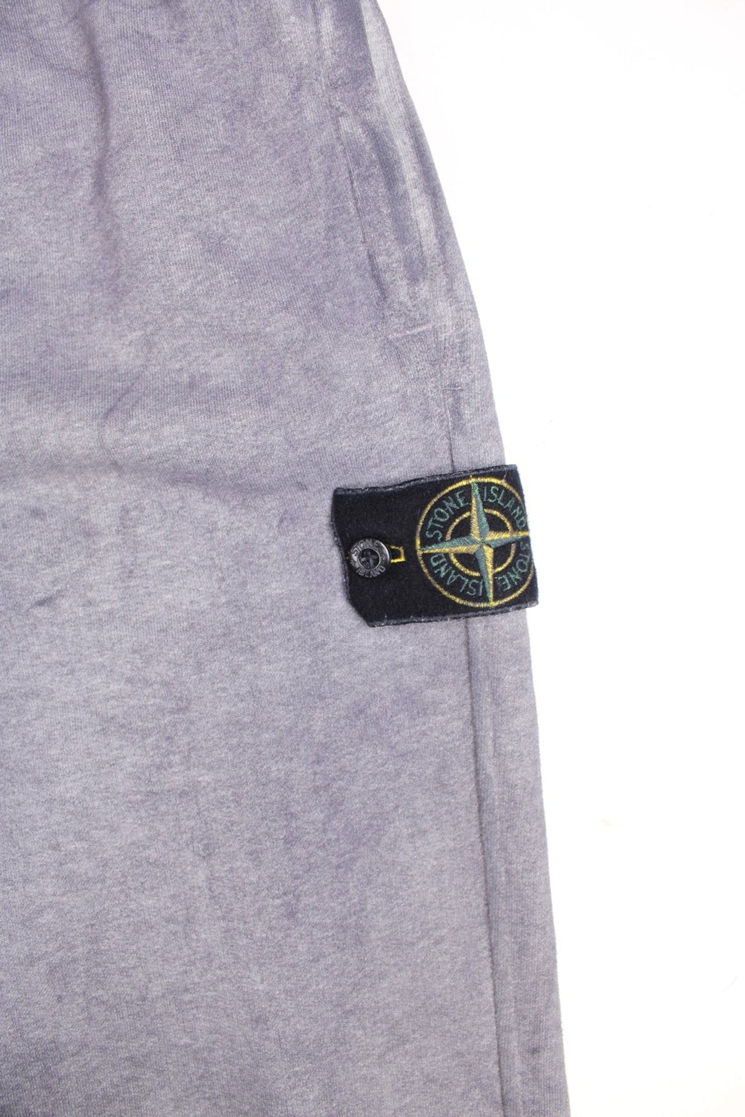  Tracksuit Bottoms in a  colourway, has pockets, an elasticated waist with drawstring, and the badge logo embroidered on the left leg. 