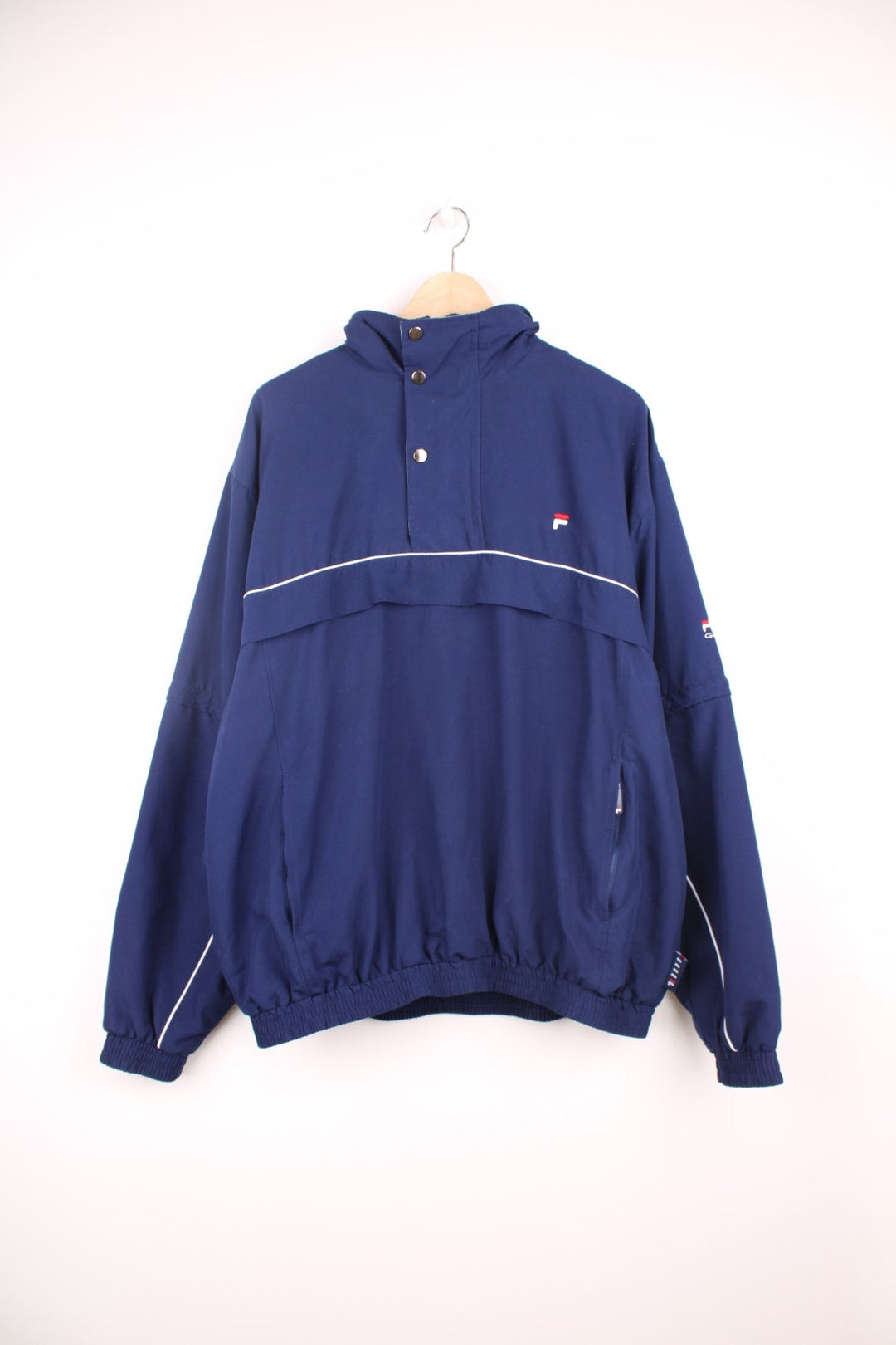 Fila Golf pullover tracksuit top/windbreaker with quarter zip. Features embroidered logo on the chest, pockets and zip off sleeves.