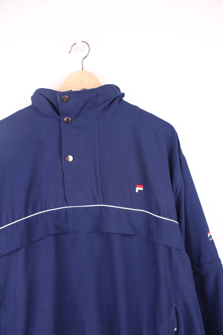 Fila Golf pullover tracksuit top/windbreaker with quarter zip. Features embroidered logo on the chest, pockets and zip off sleeves.