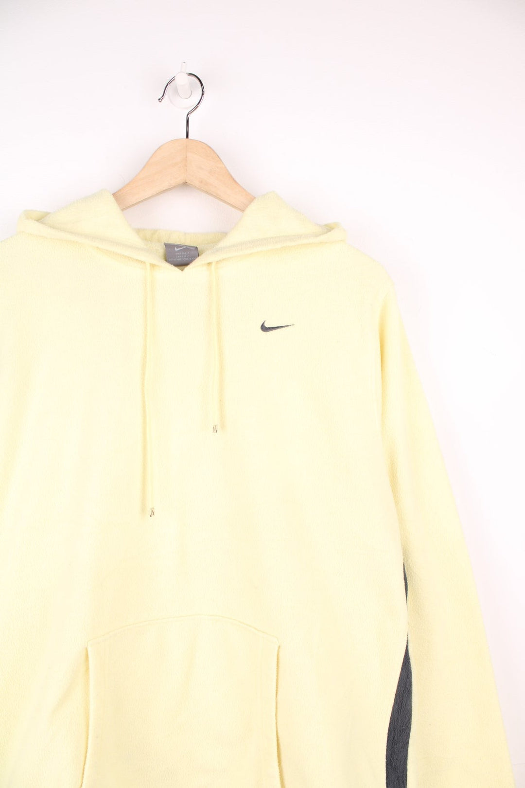 Yellow hooded Nike fleece with embroidered logo on the chest and pouch pocket.