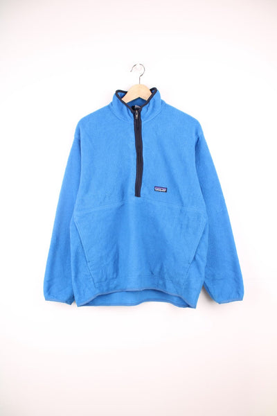 Patagonia Synchilla half zip fleece with pouch pocket and embroidered logo on the chest.