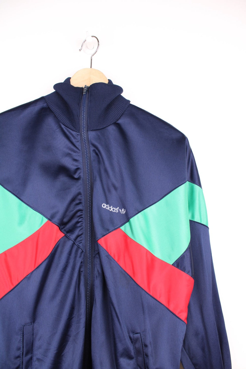 Vintage Adidas tracksuit top in blue, green and red with printed spell out logo on the chest.