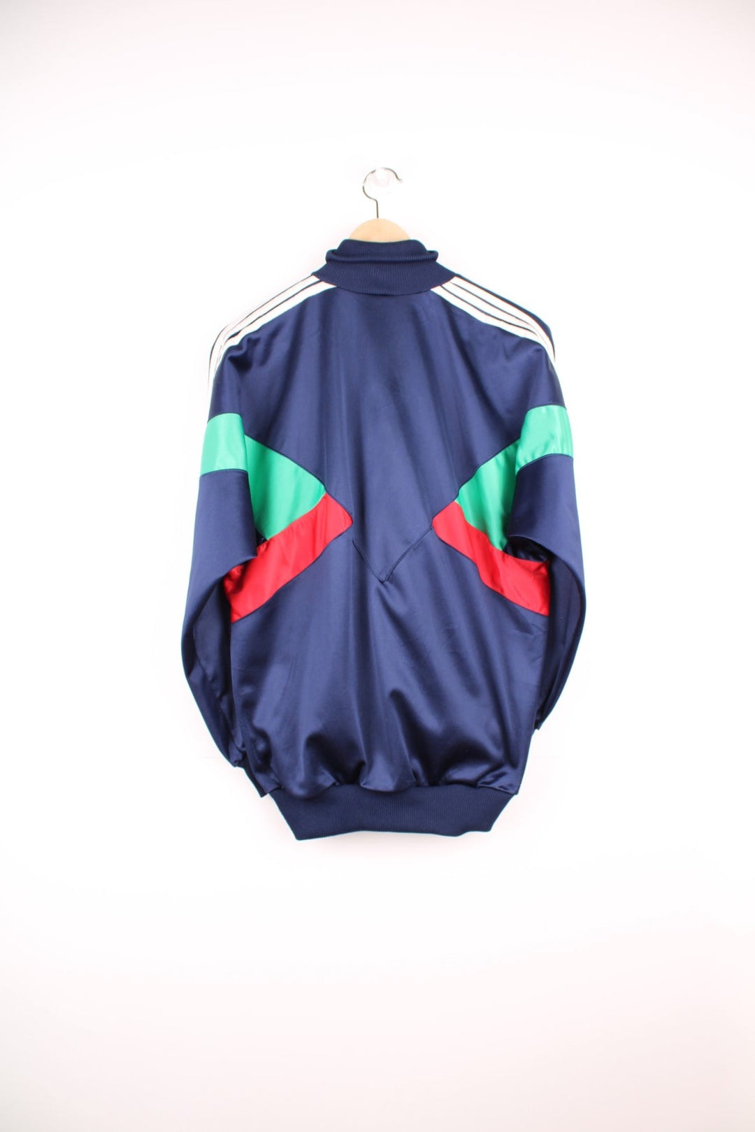 Vintage Adidas tracksuit top in blue, green and red with printed spell out logo on the chest.