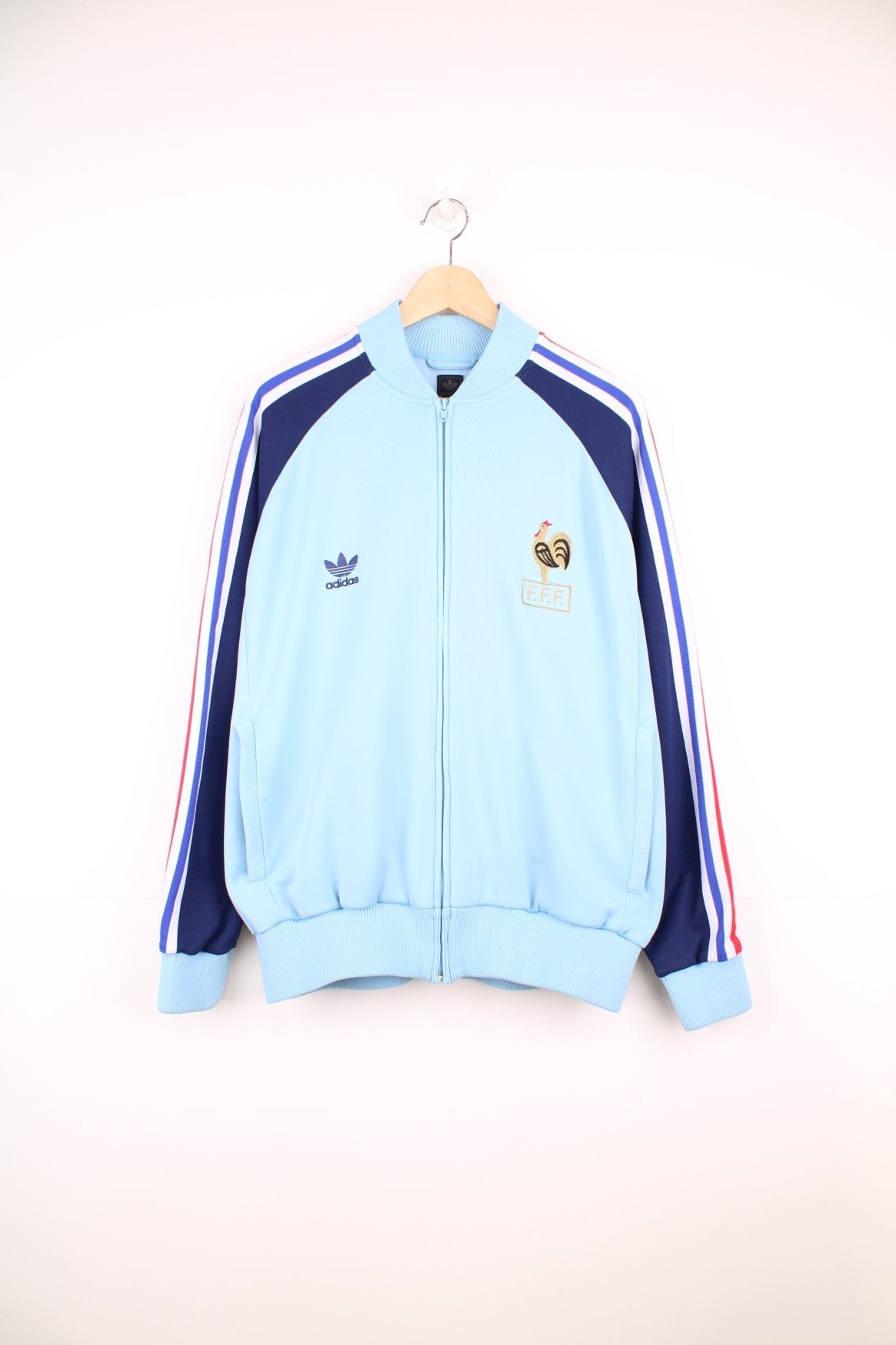 Adidas 2004 France football warm up tracksuit jacket in blue with stripes down the sleeve and logos on the chest. 