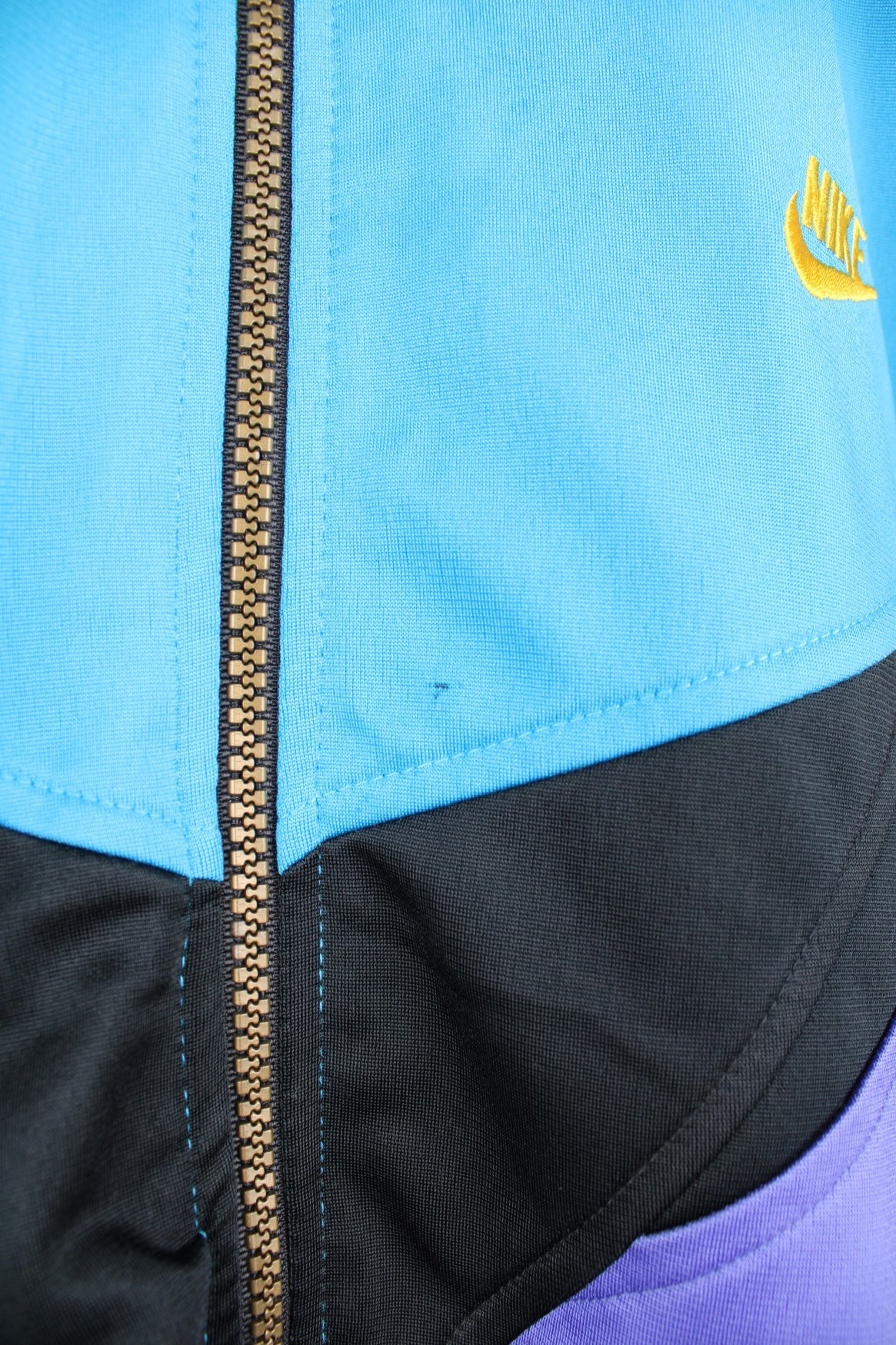 Vintage Nike Premier Soccer tracksuit top in blue, black and purple. Features embroidered logo on the chest and back.