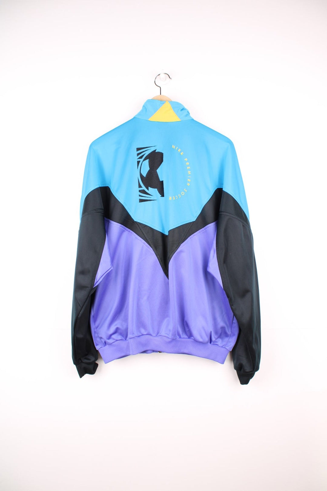 Vintage Nike Premier Soccer tracksuit top in blue, black and purple. Features embroidered logo on the chest and back.