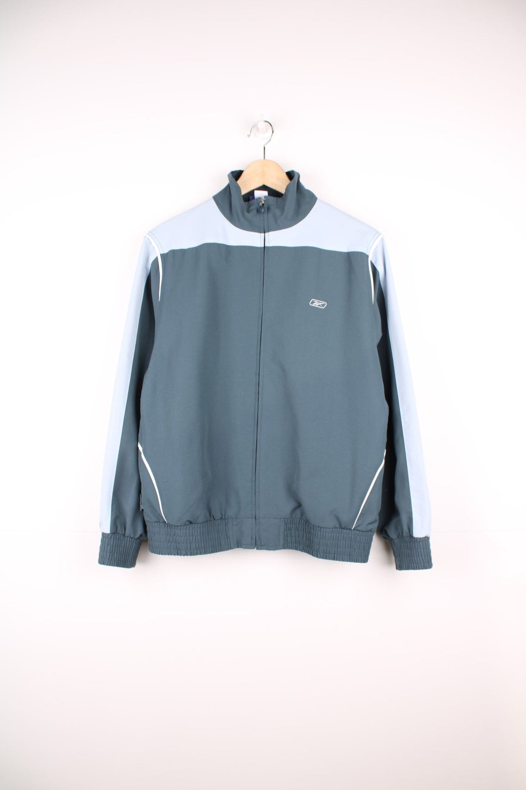 Reebok grey and blue zip through tracksuit top with embroidered logo on the chest.