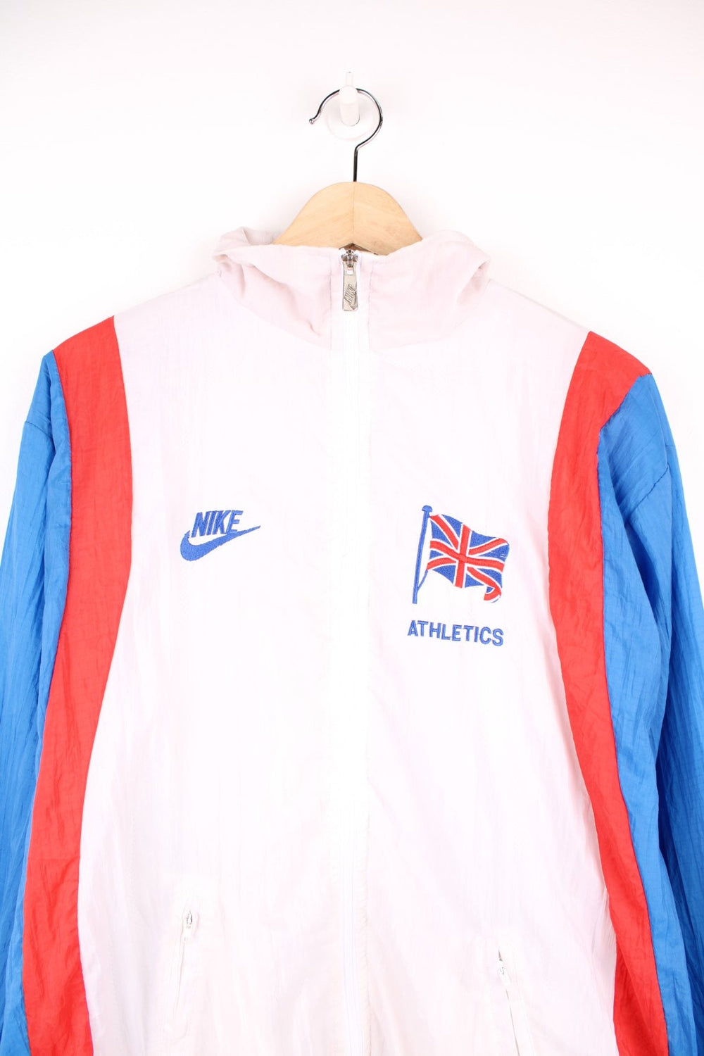 Nike GB Athletics windbreaker tracksuit top in white, red and blue. Features embroidered logos on the chest. 