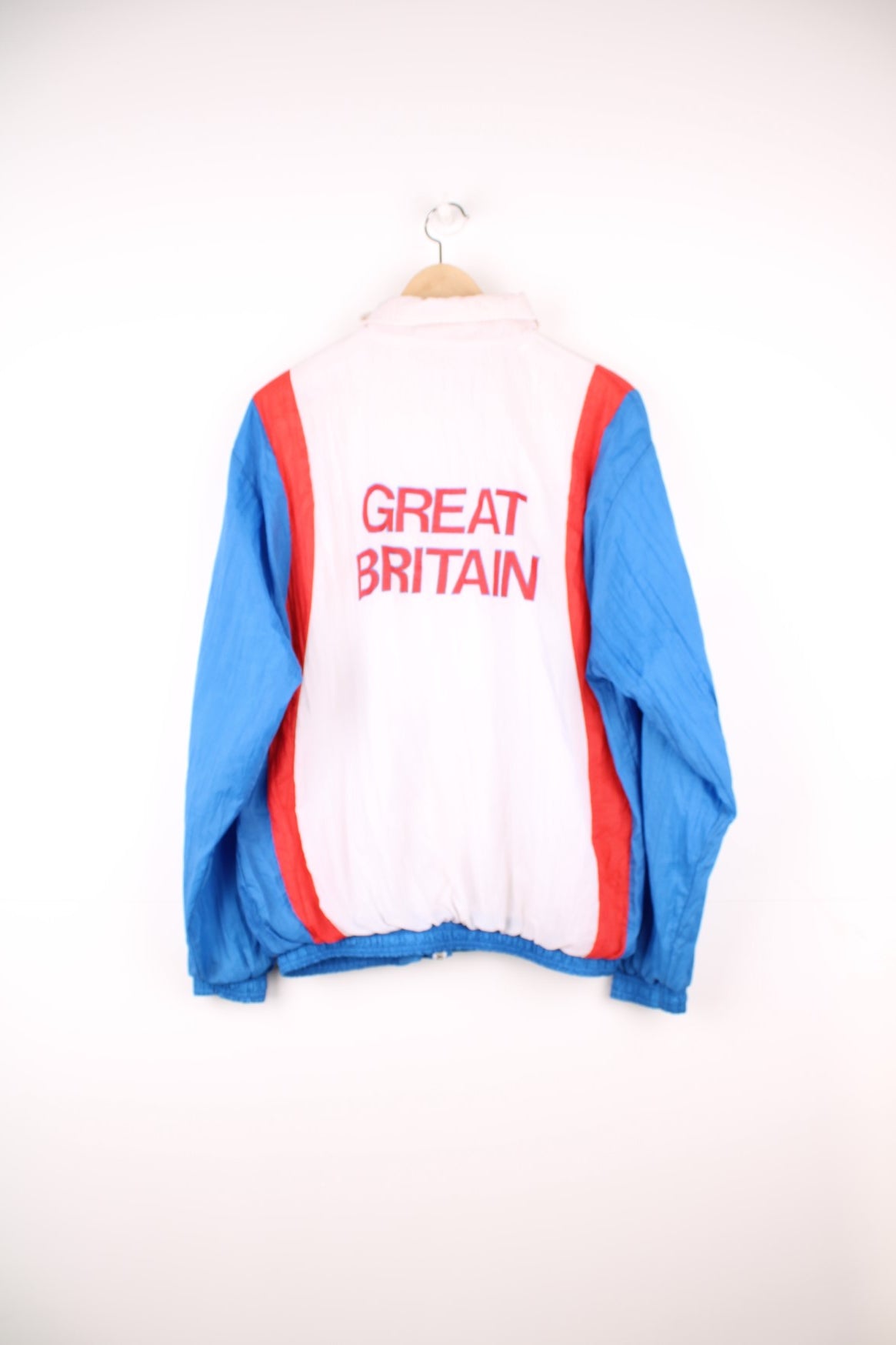 Nike GB Athletics windbreaker tracksuit top in white, red and blue. Features embroidered logos on the chest. 