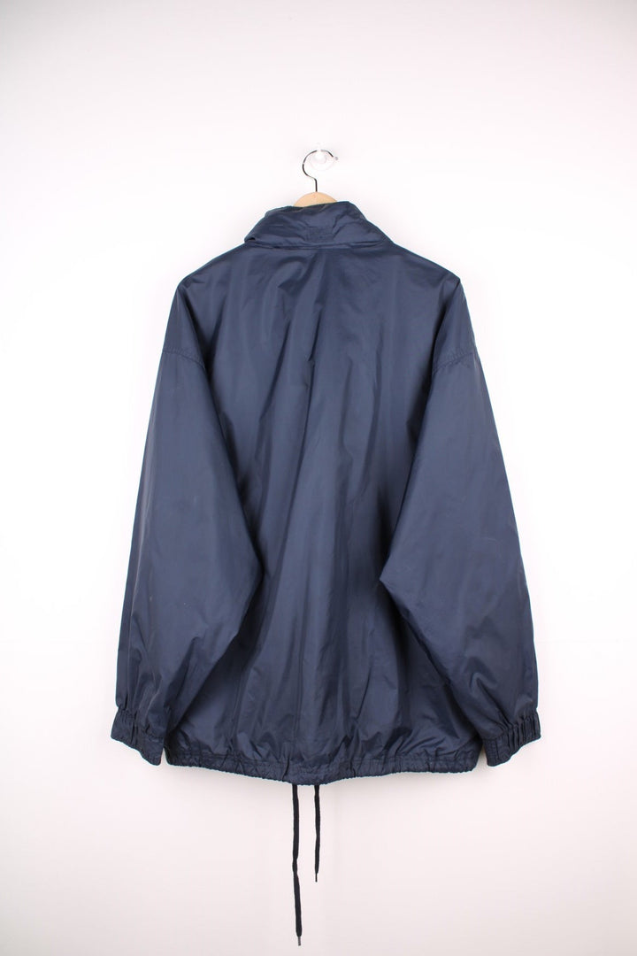 Reebok 1/2 zip shell jacket in navy blue with two pockets and drawstring waist adjustment. 