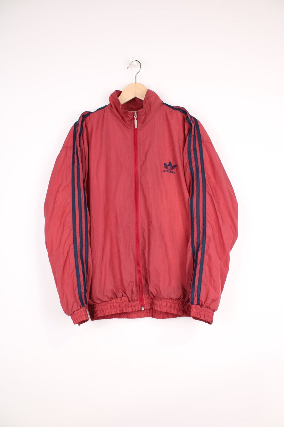 Late 90's Adidas red lightweight zip through tracksuit top features navy blue three stripe details down the sleeves