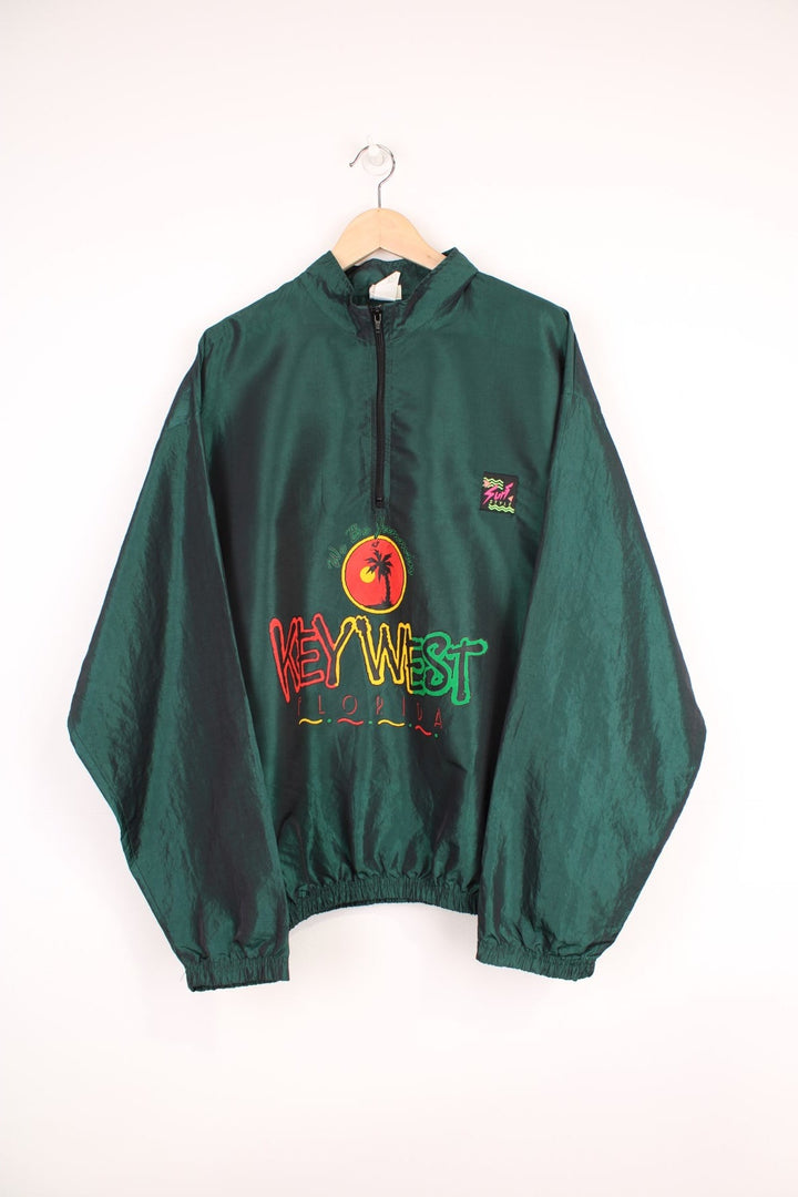 Vintage 90's Surf Style lightweight metallic green windbreaker style pullover with spell-out logo on the front