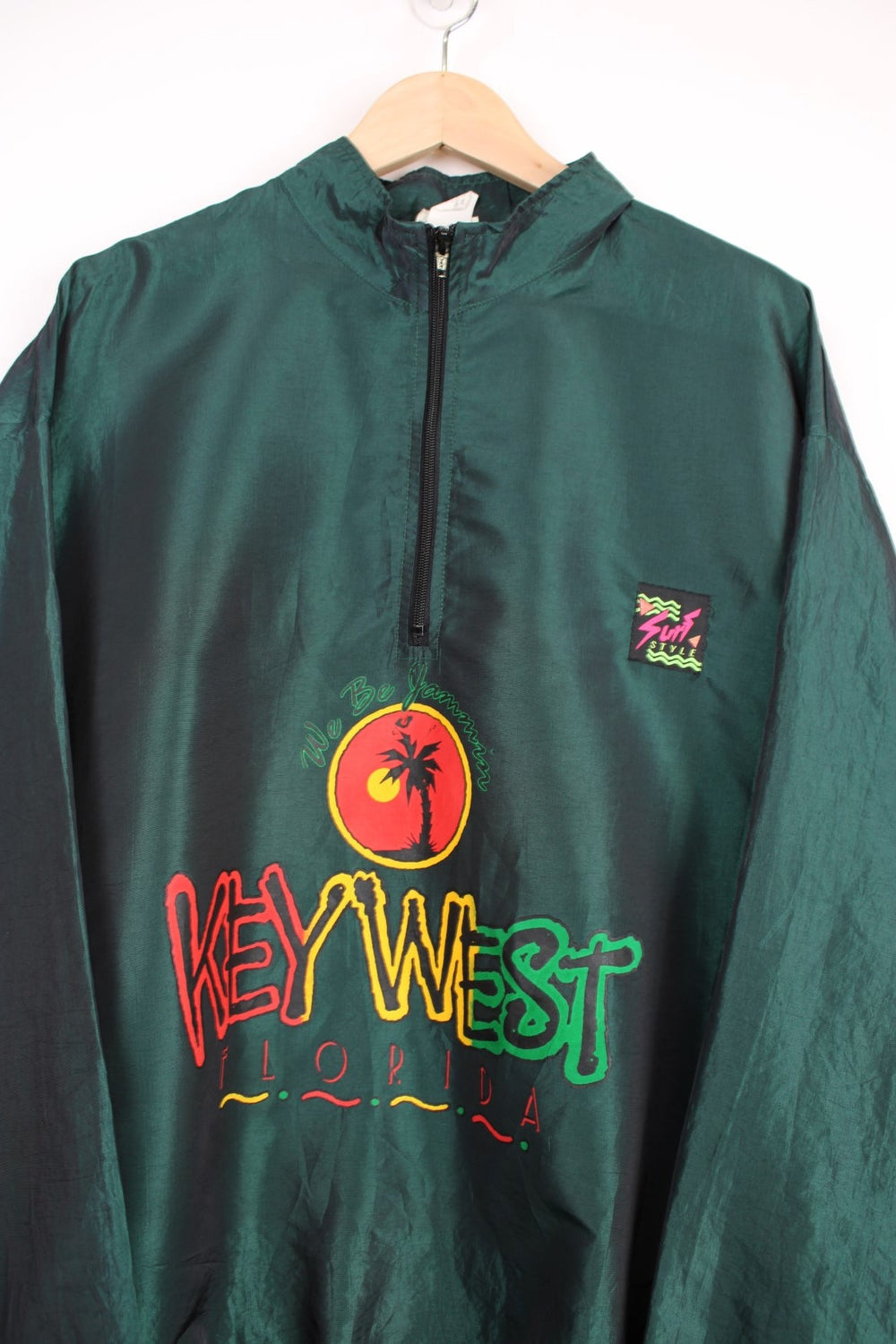 Vintage 90's Surf Style lightweight metallic green windbreaker style pullover with spell-out logo on the front