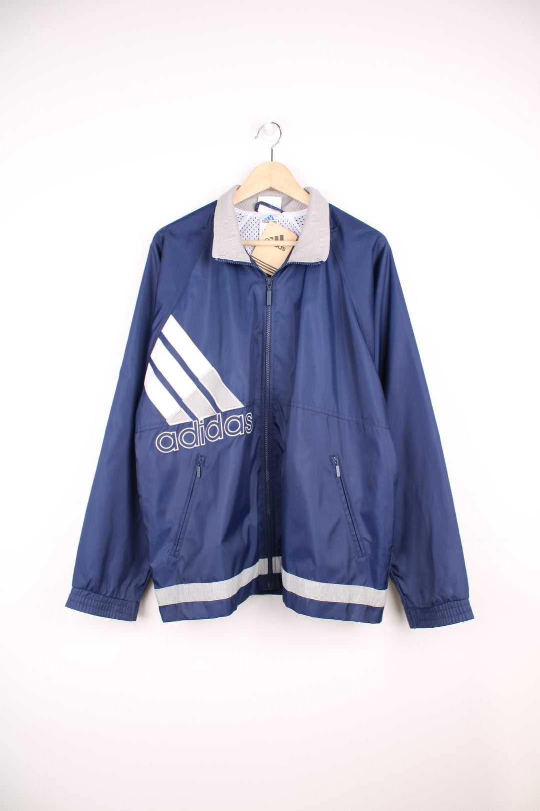 Blue, grey and white vintage Adidas zip through tracksuit top. Features large embroidered logo. 