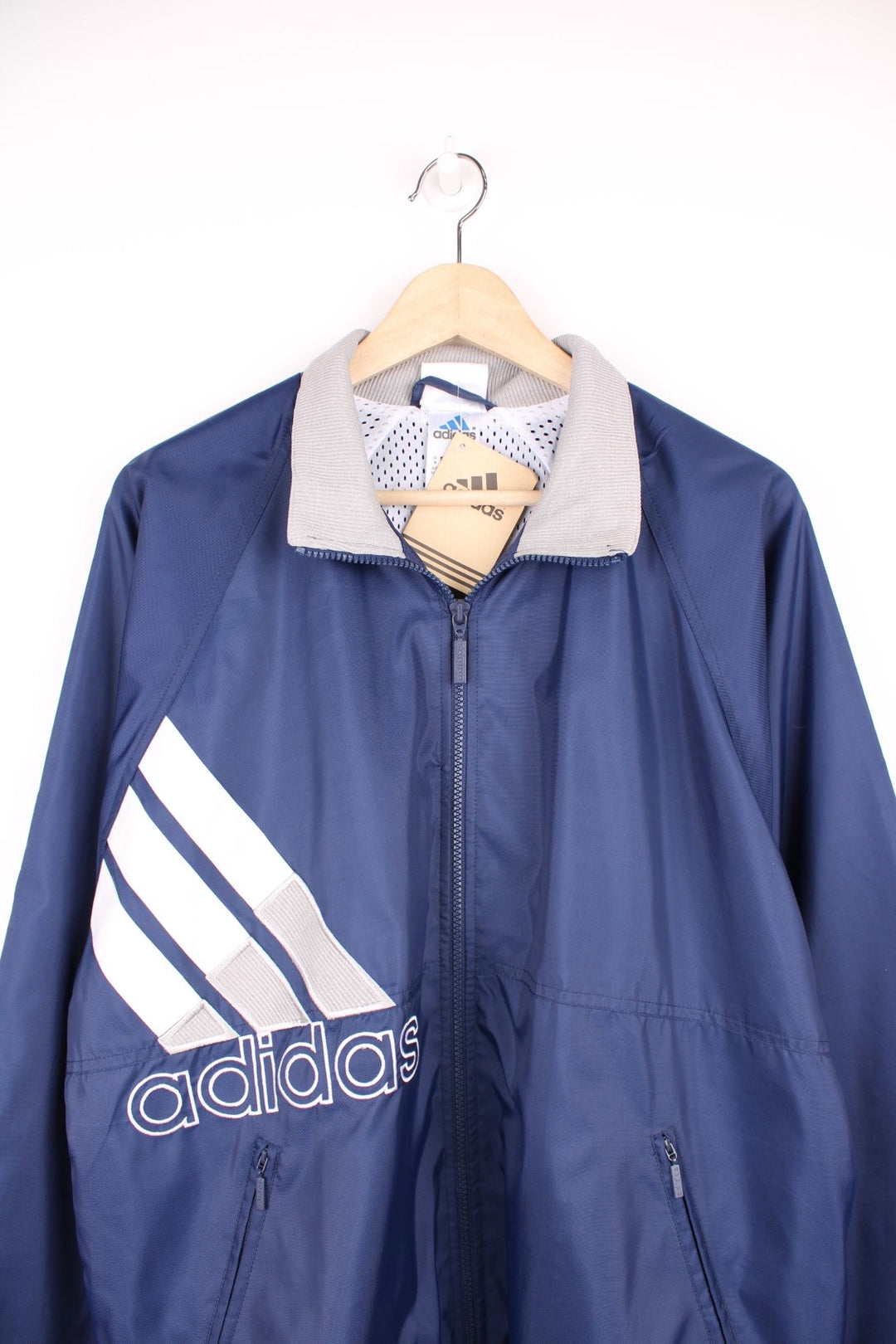 Blue, grey and white vintage Adidas zip through tracksuit top. Features large embroidered logo. 