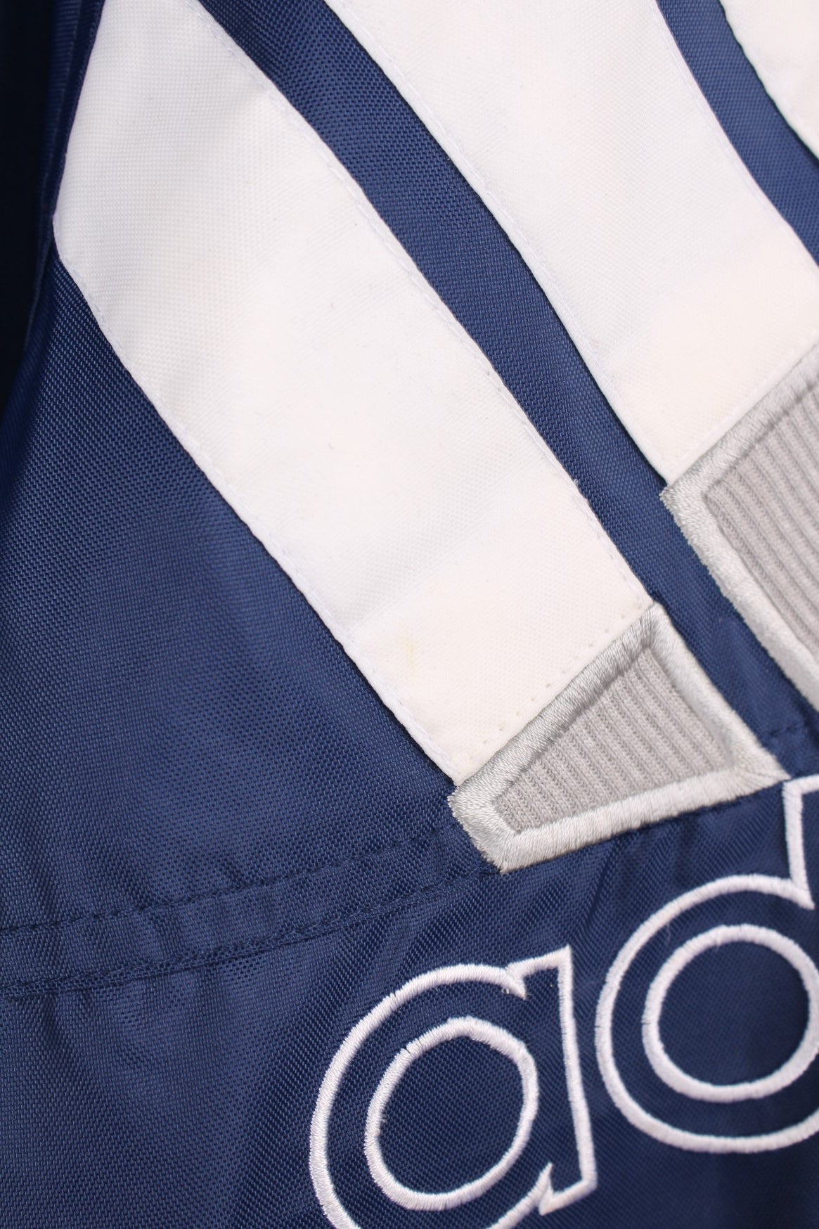 Blue, grey and white vintage Adidas zip through tracksuit top. Features large embroidered logo. 