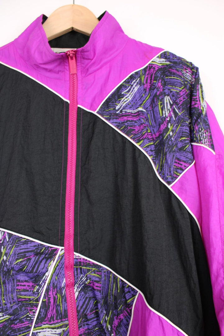 90's Reebok shell jacket in purple colour way, features fun graphic panels and white piping.