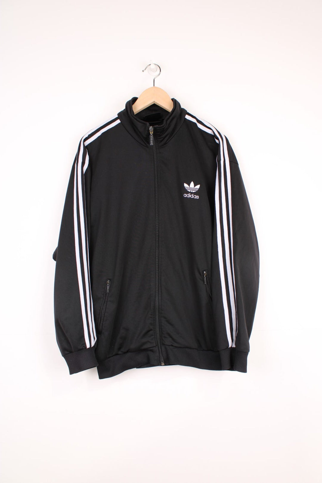 Vintage all black Adidas zip through satin style tracksuit jacket, features signature three stripe details down the sleeves in white and embroidered logo on the chest