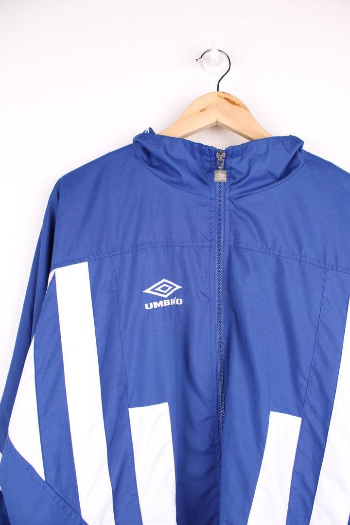 Vintage  Tracksuit Jacket in a  and white patterned colourway, zip up closure and has side pockets, and the logo embroidered on the front and back.