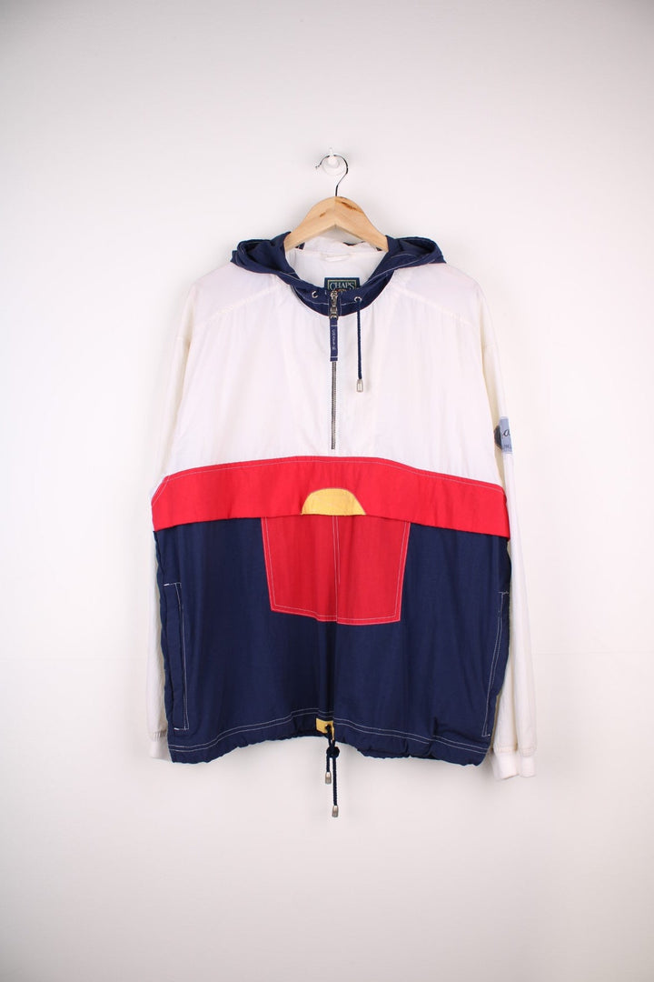 Vintage 90's Chaps by Ralph Lauren Pullover Windbreaker in a white, red and blue patterned colourway, half zip up closure, multiple pockets, hooded, and has the logo embroidered on the left sleeve.