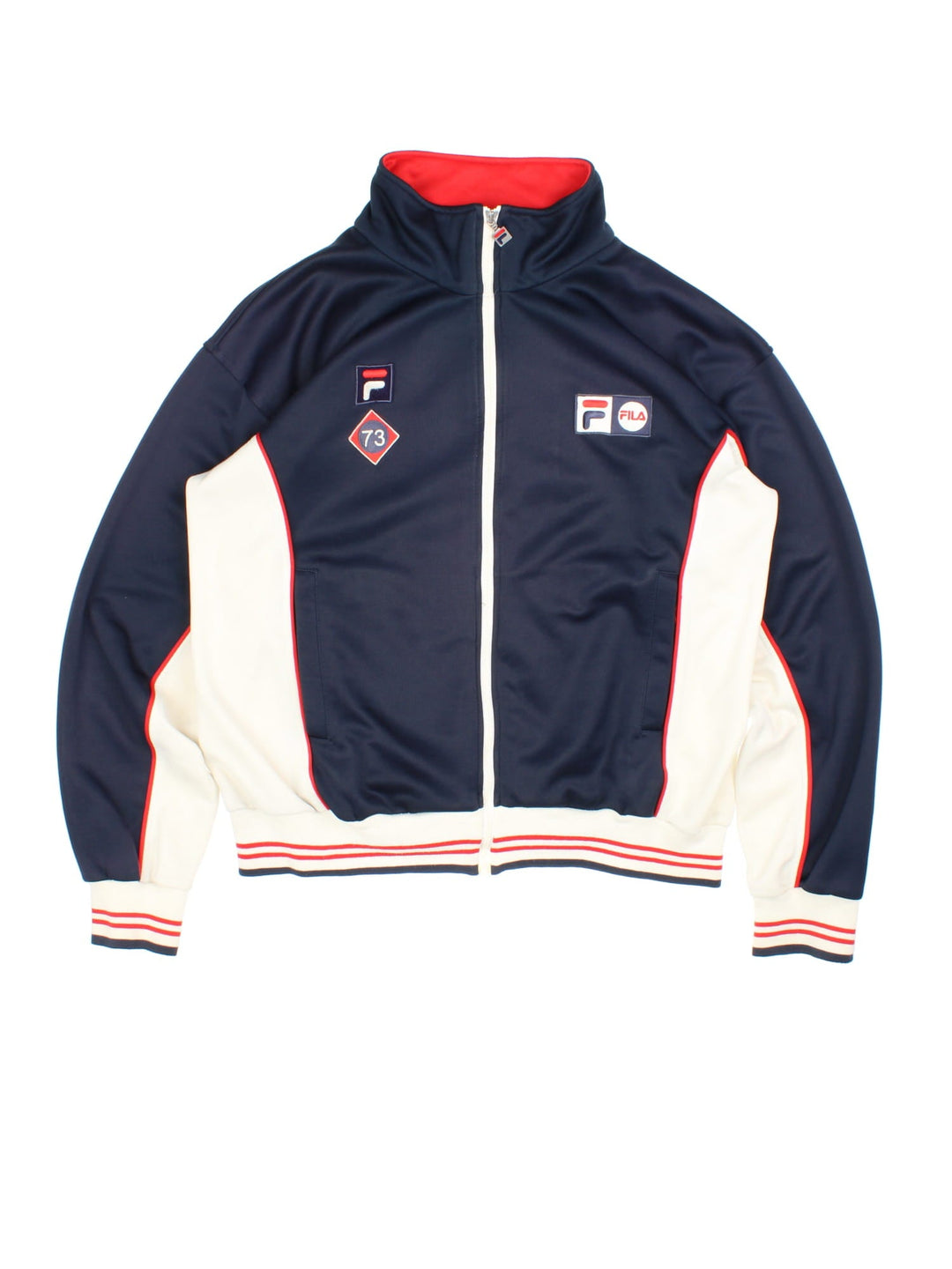 Vintage Fila Tracksuit Jacket in a blue, red and white colourway. Zips up and has side pockets, and the logos embroidered on the front.