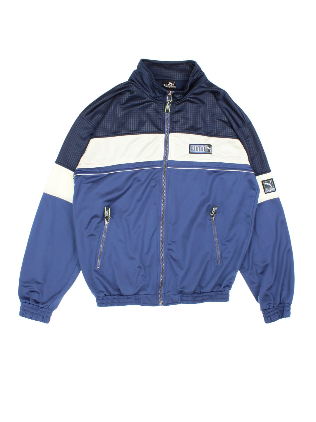 Vintage Puma Tracksuit Jacket in a blue and white colourway. Zips up and has side pockets, and the logo embroidered on the front.