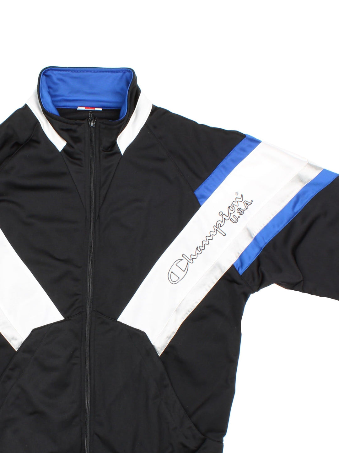 Vintage Champion Tracksuit Jacket in a black, white and blue patterned colourway. Zips up and has side pockets, and has the logo spell out embroidered on the front and on the back.