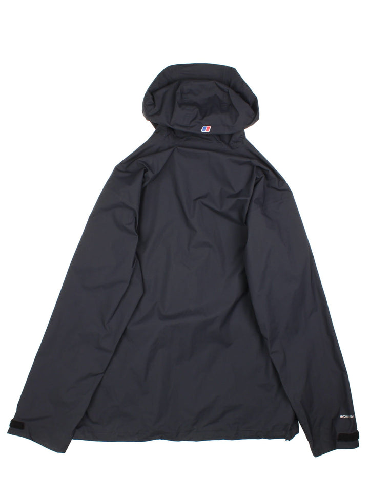 Berghaus Deluge Light Jacket in a black colourway. Zips up and has side pockets, hooded, and has the logo printed on the front.