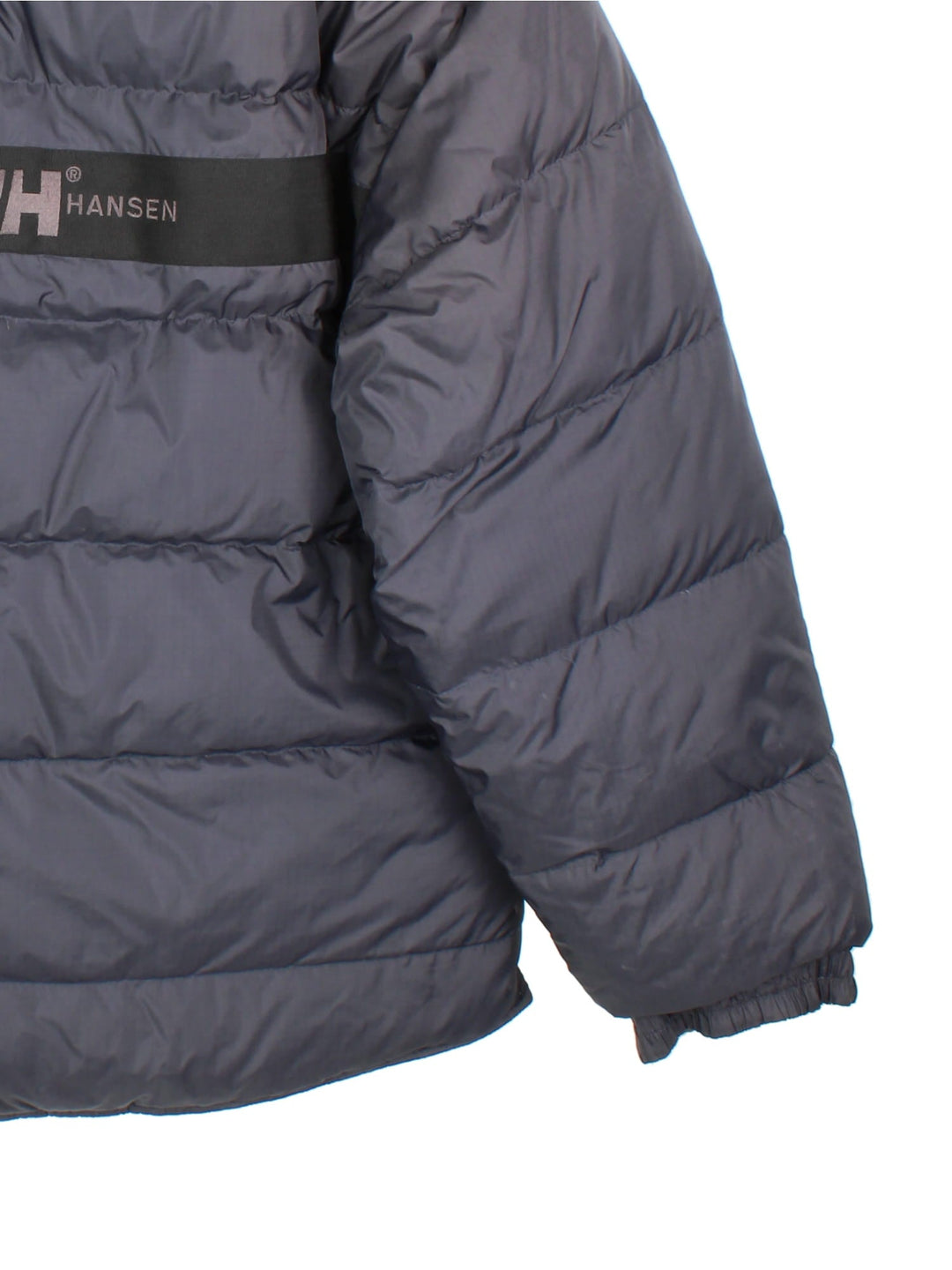 Vintage Helly Hansen Reversible Puffer Coat in either a black or beige colourway options. Zips up and has side pockets, insulated lining, and has the logo embroidered on the front and back.