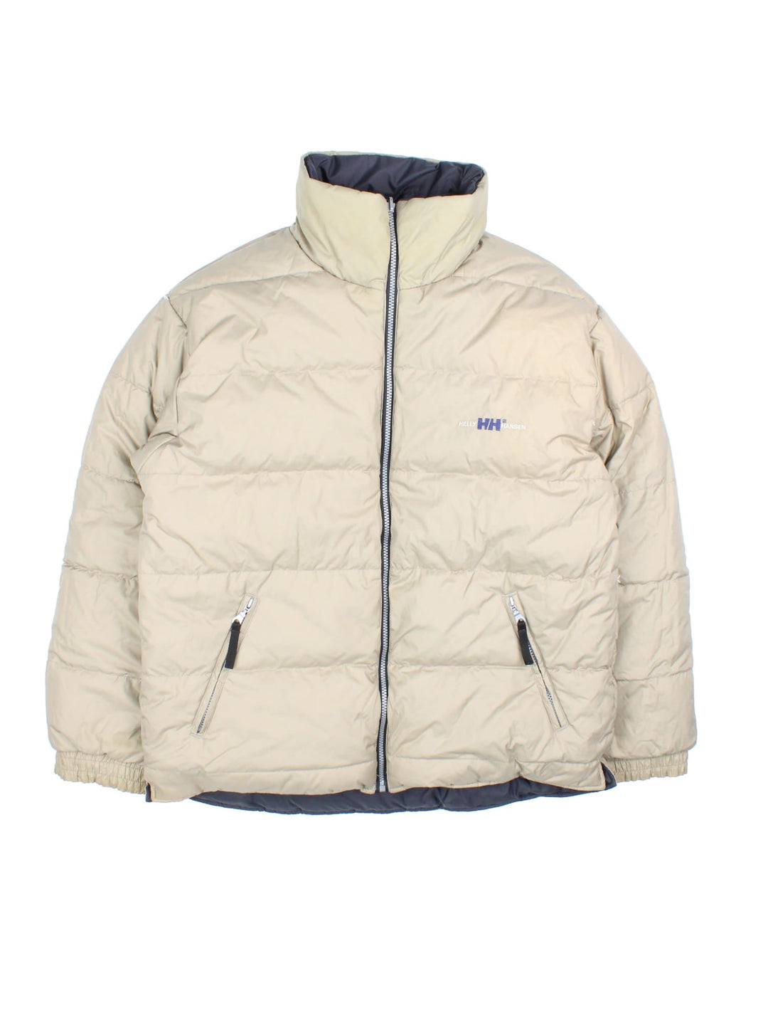 Vintage Helly Hansen Reversible Puffer Coat in either a black or beige colourway options. Zips up and has side pockets, insulated lining, and has the logo embroidered on the front and back.