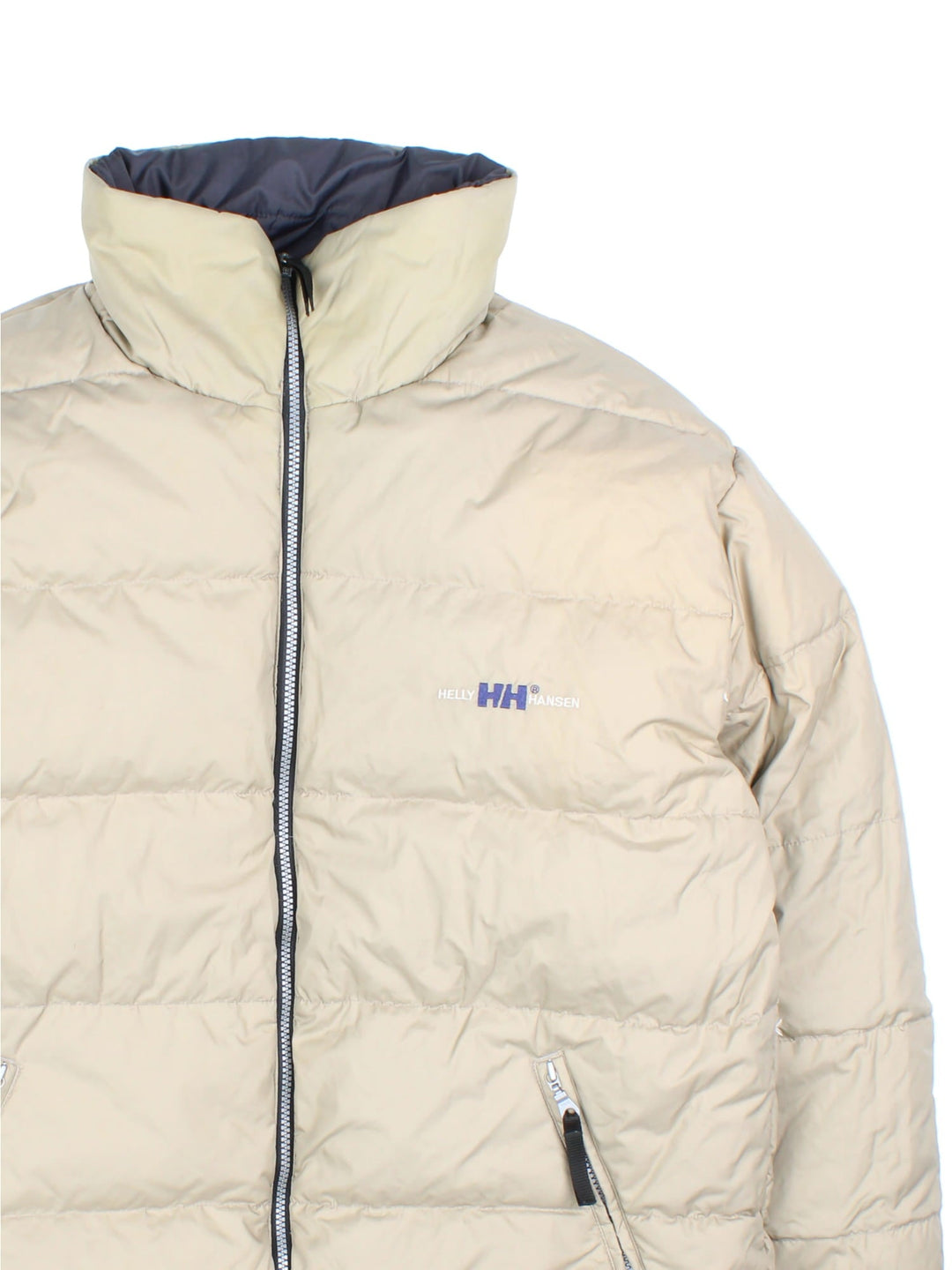 Vintage Helly Hansen Reversible Puffer Coat in either a black or beige colourway options. Zips up and has side pockets, insulated lining, and has the logo embroidered on the front and back.