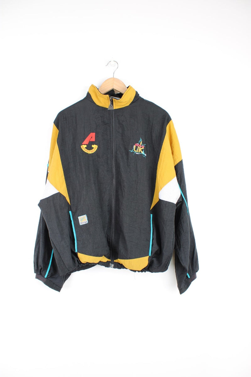 Vintage Gola tracksuit top in black and yellow with embroidered logo on the chest.