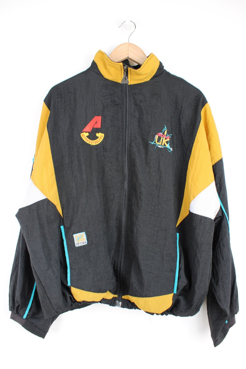 Vintage Gola tracksuit top in black and yellow with embroidered logo on the chest.