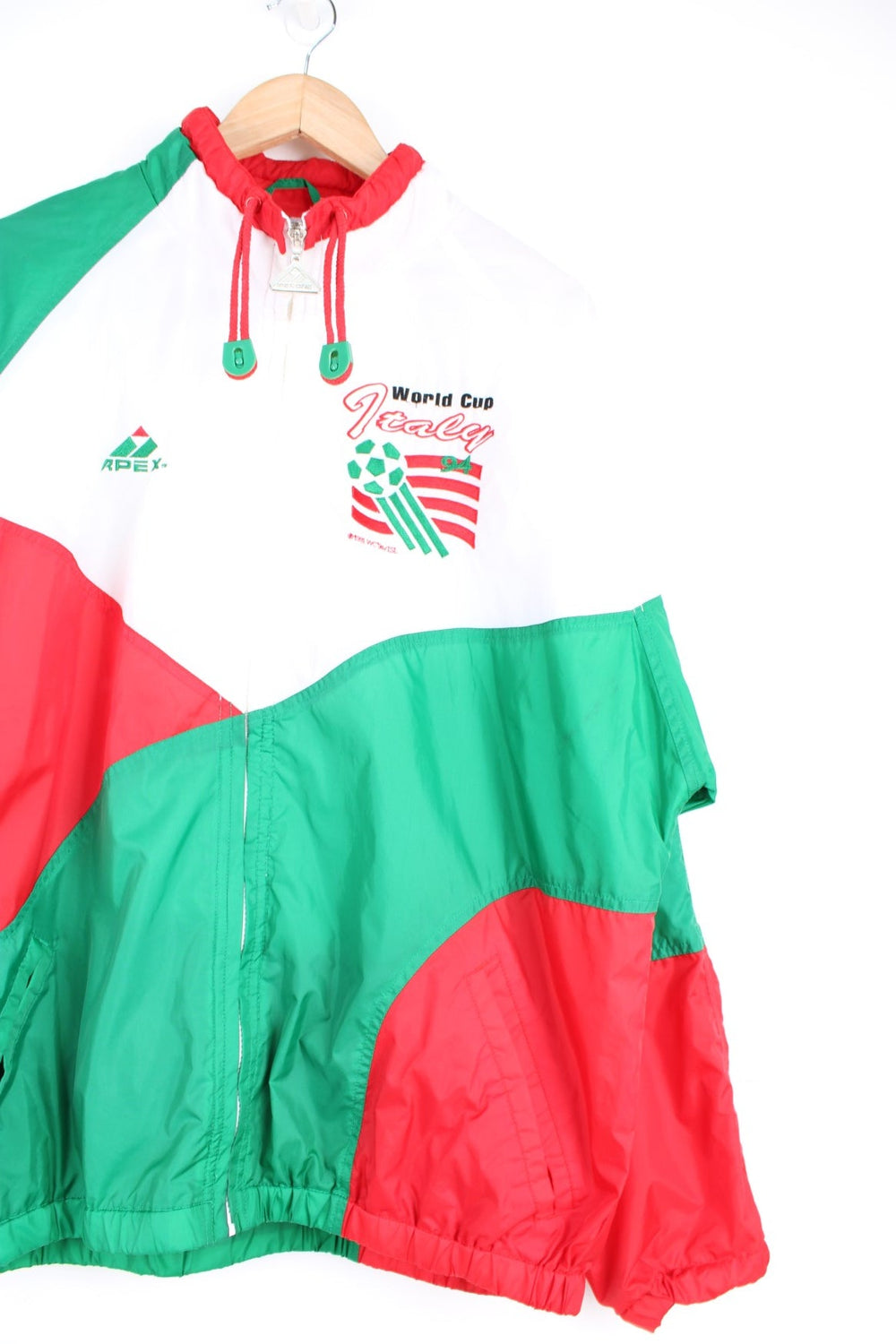 World Cup Italy 1994 Apex tracksuit top in white, green and red. Features embroidered logo on the chest and sleeve. 