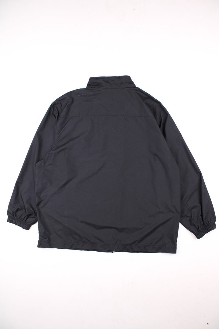 Vintage 90's Nike windbreaker in black, with three pockets, zip closure, and an embroidered logo on the chest.